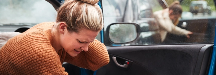 Chiropractic Stratford CT Car Accident Woman holding her neck after a car accident.