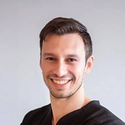 Dr. Andrew Pesale smiling.