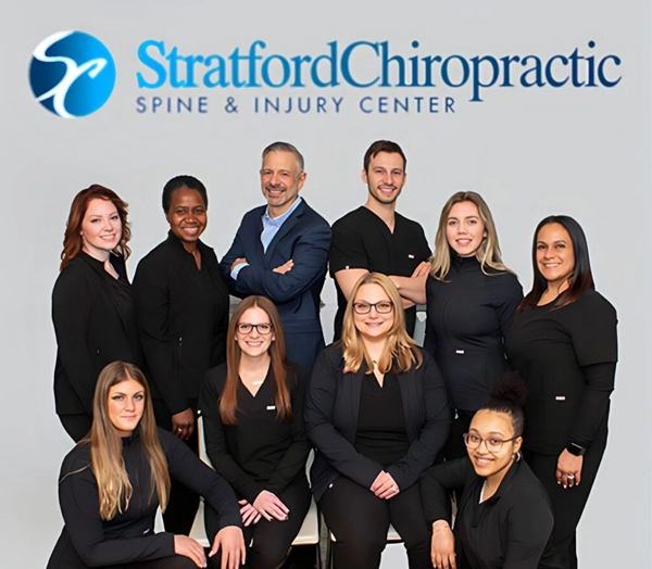 Chiropractor Stratford CT Robert Pesale And Andrew Pesale With Team Robert Pesale And Andrew Pesale smiling with their chiropractic team.